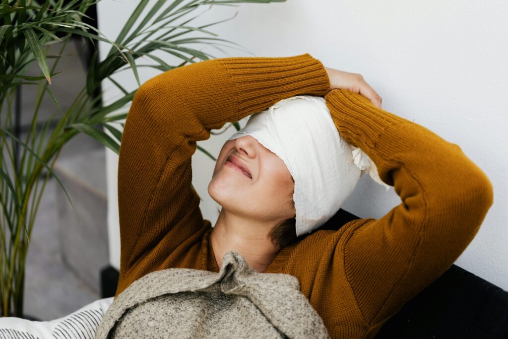 women hold her injured head