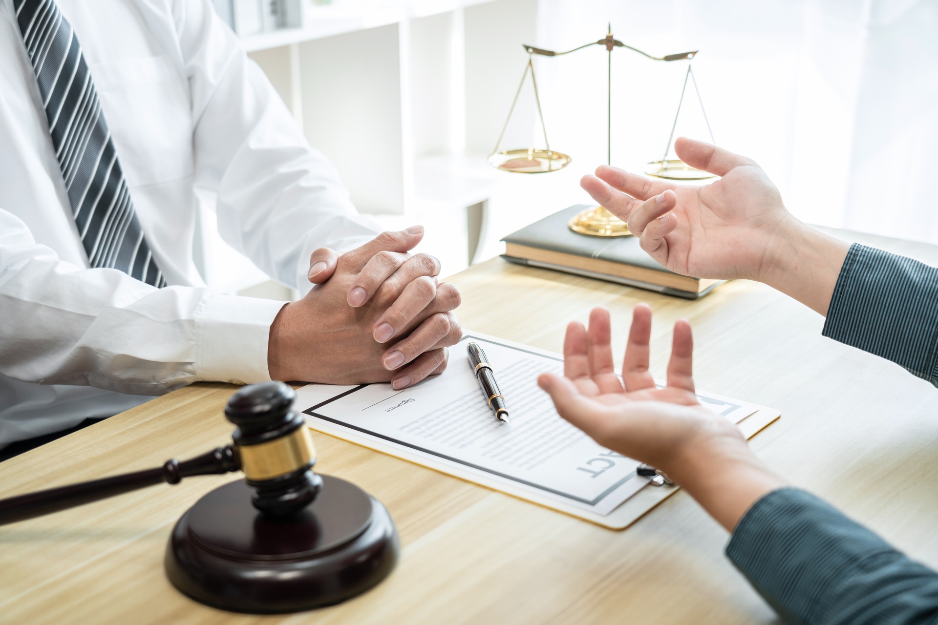 lawyer is meeting with man client to discuss