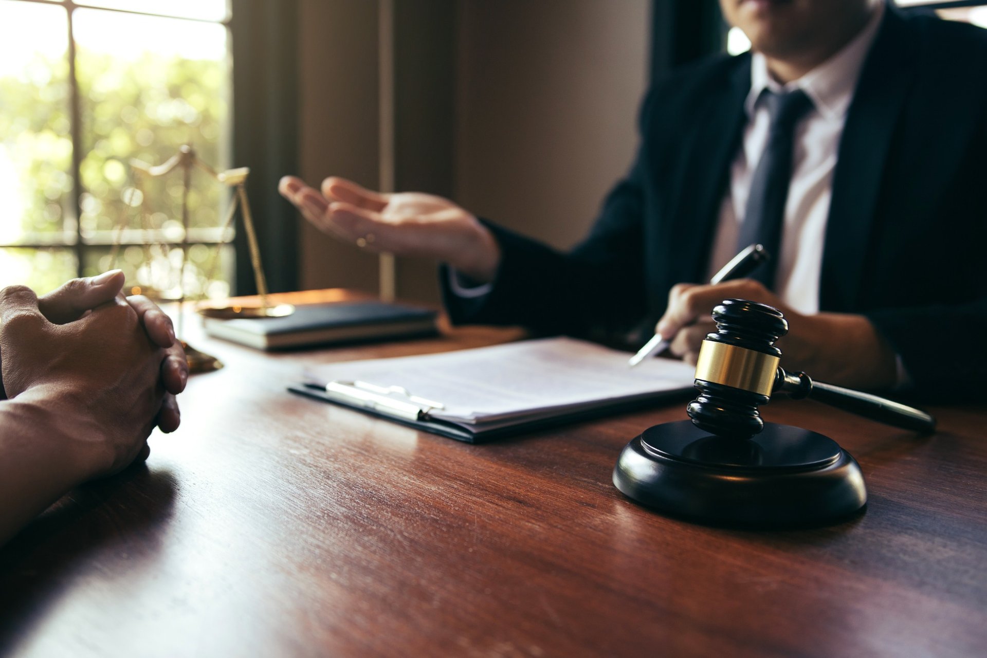 Lawyer explaining legal consequences during client consultation